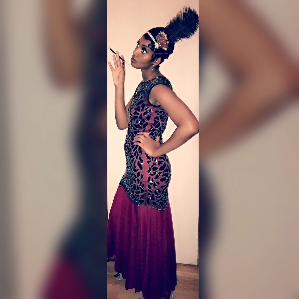 Jeneé in a beaded maroon gown